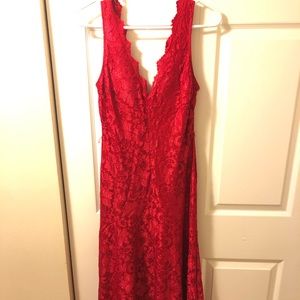 Floor length red lace ball gown.